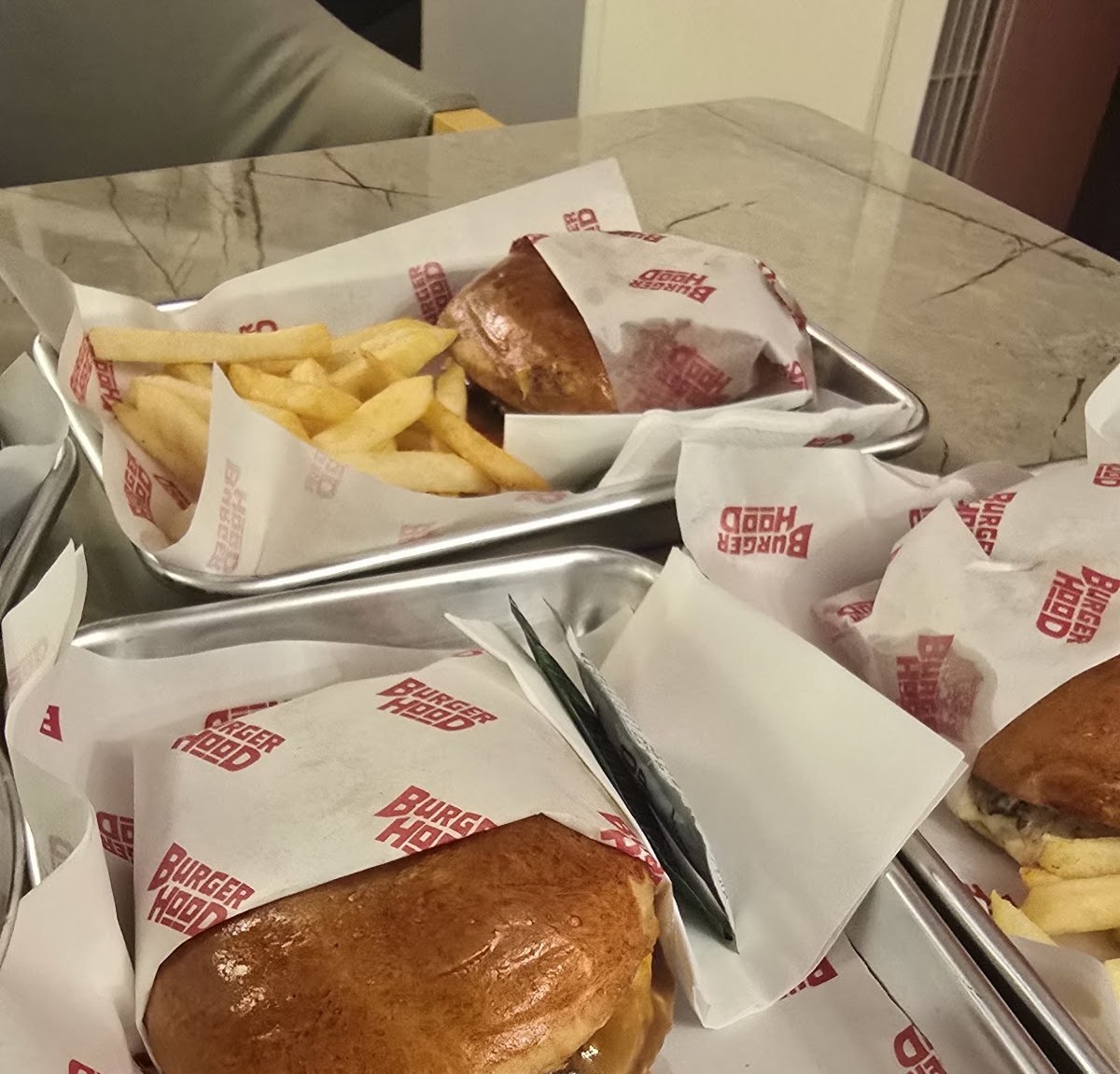 Burgers and fries on Burgerhood trays